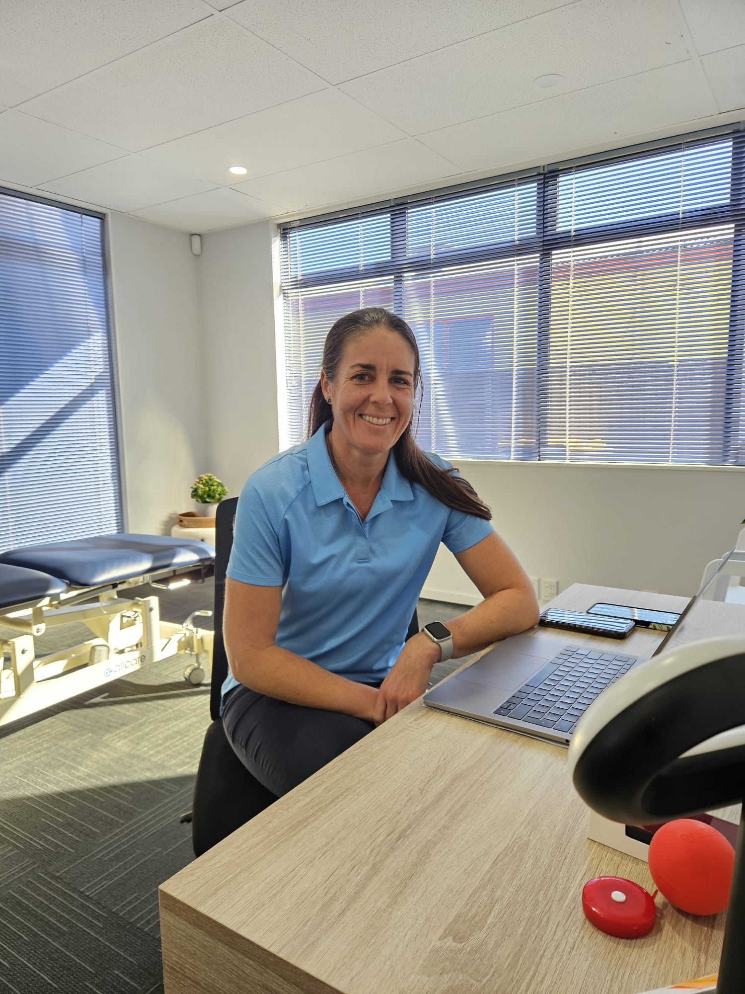 Candice Peters at her desk in the Way Forward Physio clinic